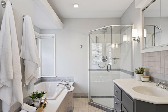 bathroom with a garden tub, backsplash, a stall shower, vanity, and tile patterned flooring