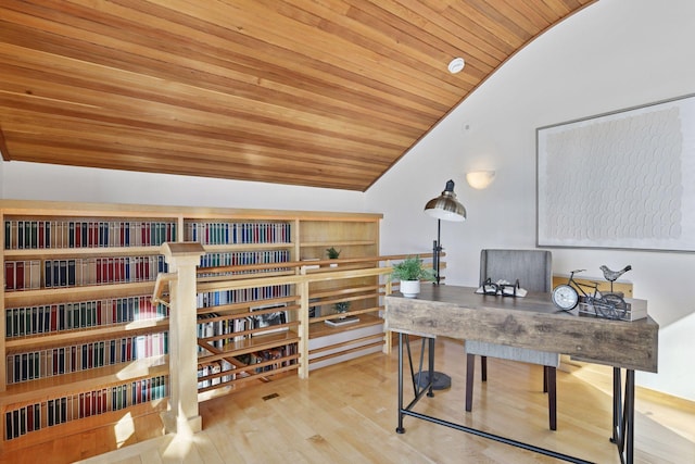 office area featuring vaulted ceiling, wooden ceiling, and wood finished floors