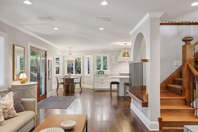 living room with ornamental molding, recessed lighting, dark wood-style flooring, and stairs