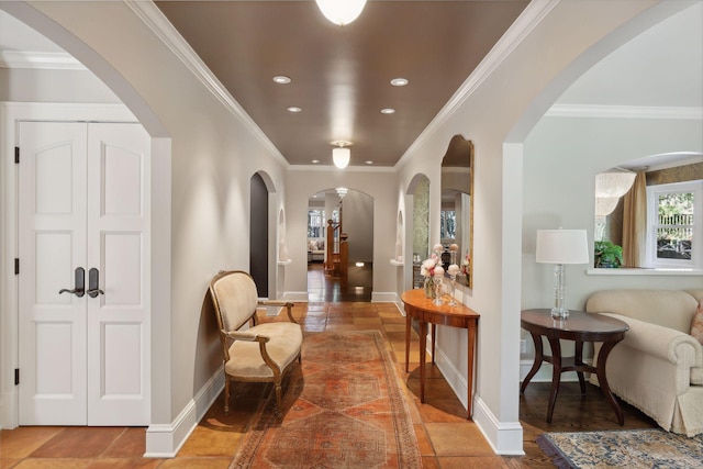 sitting room with ornamental molding, recessed lighting, and baseboards