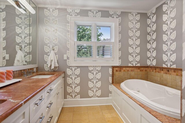 bathroom featuring tile patterned floors, a whirlpool tub, baseboards, and wallpapered walls