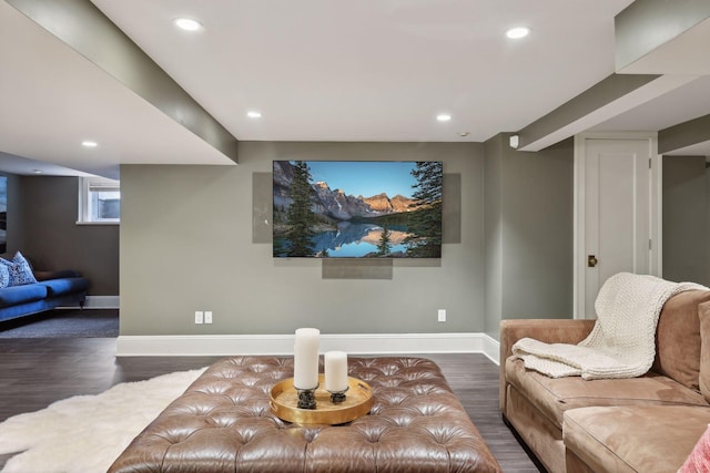 living area with baseboards, wood finished floors, and recessed lighting