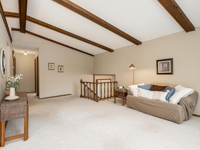 living room featuring vaulted ceiling with beams and light colored carpet