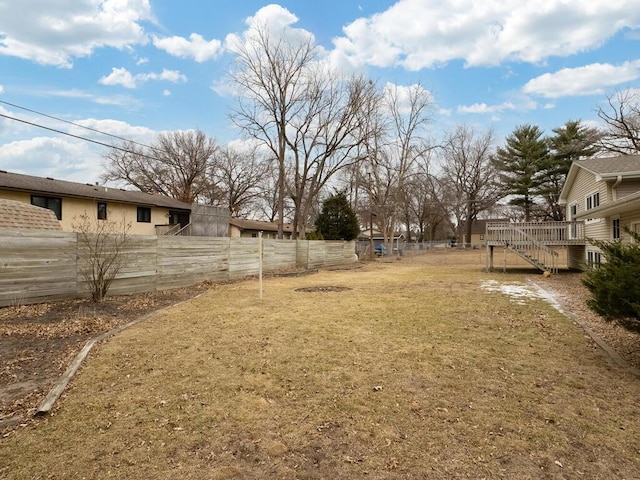 view of yard with stairway and fence