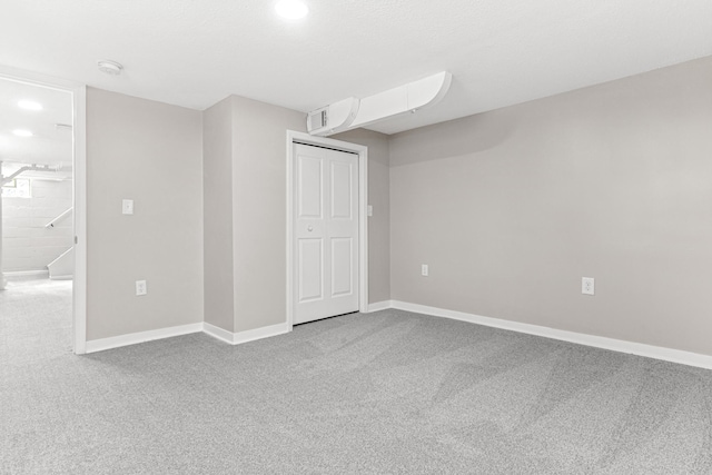 unfurnished bedroom featuring a closet, visible vents, baseboards, and carpet