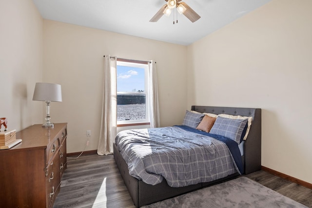 bedroom featuring dark wood-style floors, baseboards, and ceiling fan