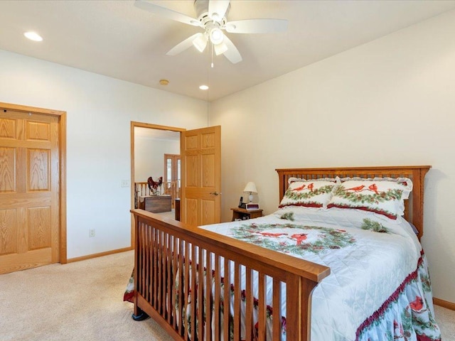 bedroom with light carpet, recessed lighting, a ceiling fan, and baseboards