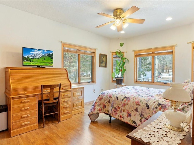 bedroom featuring multiple windows, a ceiling fan, recessed lighting, and light wood finished floors