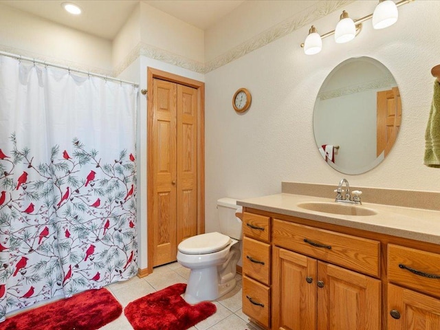 bathroom with vanity, tile patterned floors, toilet, and a shower with shower curtain