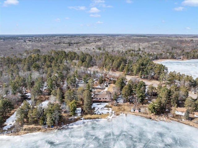 bird's eye view featuring a wooded view