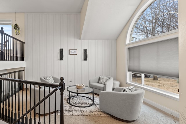 sitting room featuring baseboards and a wealth of natural light