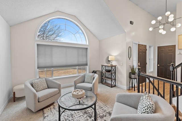 living room with a chandelier, high vaulted ceiling, baseboards, stairs, and carpet