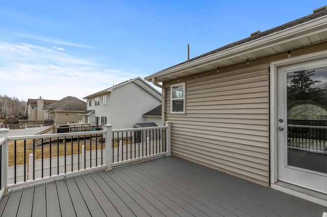 wooden deck featuring a residential view