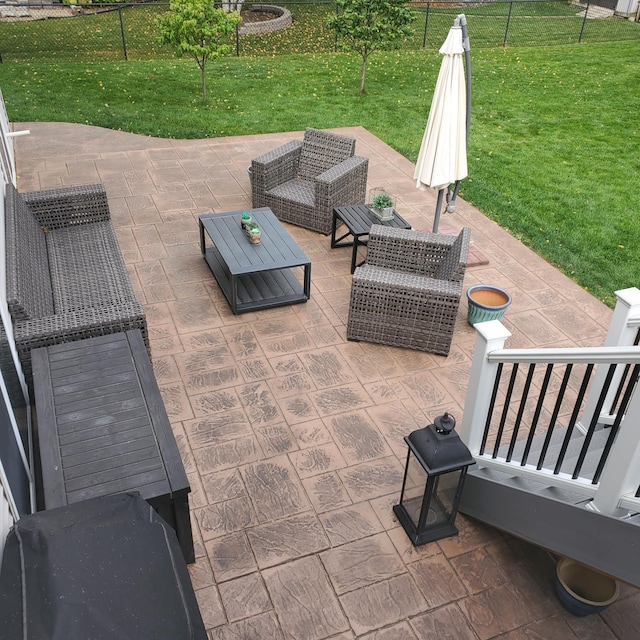 view of patio with outdoor lounge area and fence