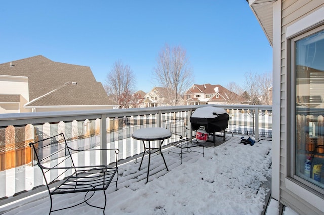 snow covered deck with grilling area