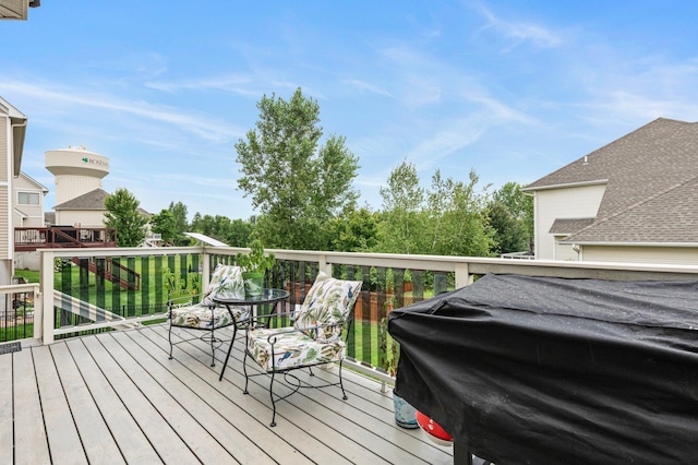 wooden deck featuring area for grilling