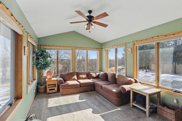 sunroom with a wealth of natural light, a ceiling fan, and vaulted ceiling