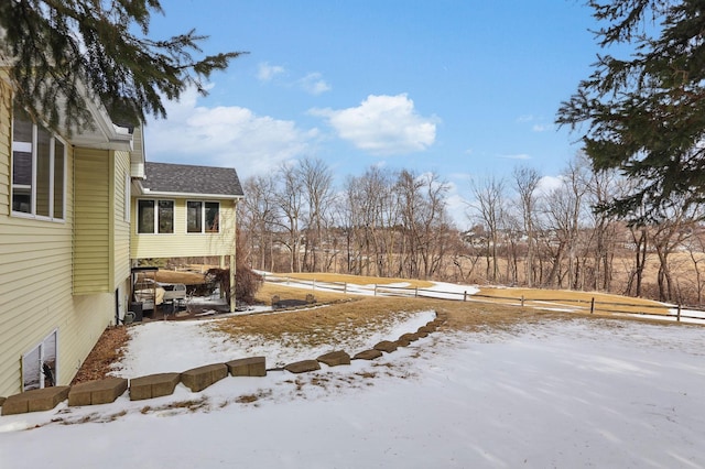 view of yard layered in snow