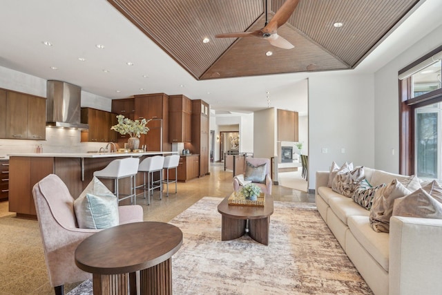 living room featuring ceiling fan, wood ceiling, vaulted ceiling, and recessed lighting