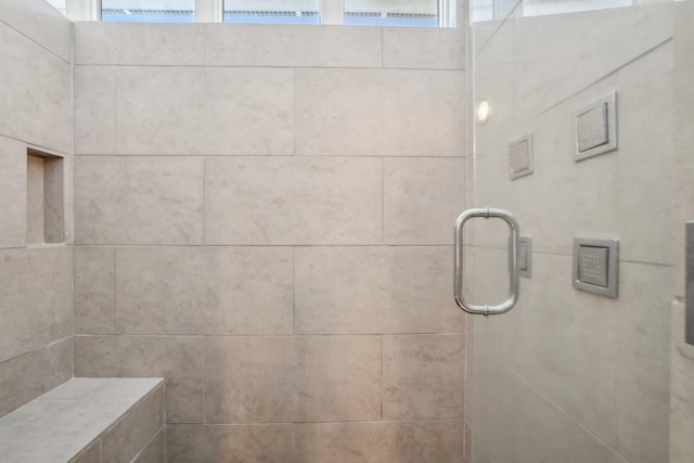 bathroom featuring tiled shower