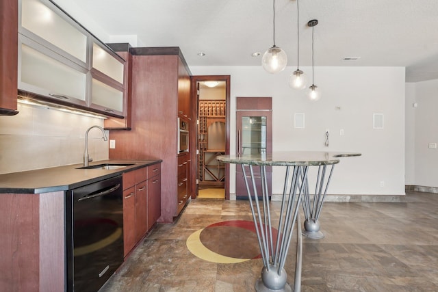 kitchen with visible vents, dishwasher, dark countertops, glass insert cabinets, and a sink