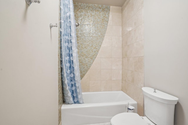 full bathroom featuring toilet and shower / bathtub combination with curtain