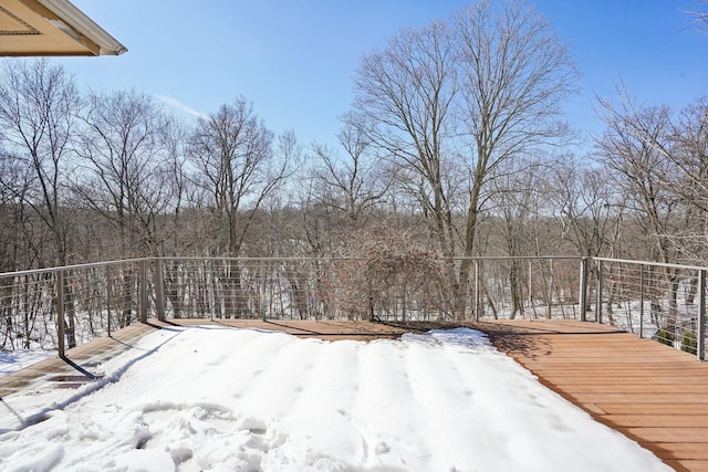 yard covered in snow featuring a balcony