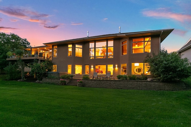 9730 Sky Ln, Eden Prairie, MN 55347 - rear view of house with a yard, stucco siding, and a balcony