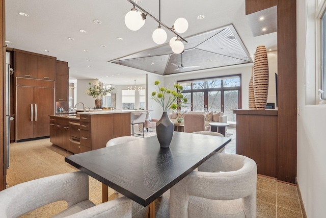 9730 Sky Ln, Eden Prairie, MN 55347 - dining area featuring a chandelier, recessed lighting, and granite floors