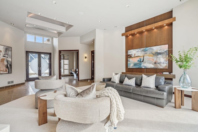 9730 Sky Ln, Eden Prairie, MN 55347 - living room with a towering ceiling, baseboards, tile patterned floors, and recessed lighting