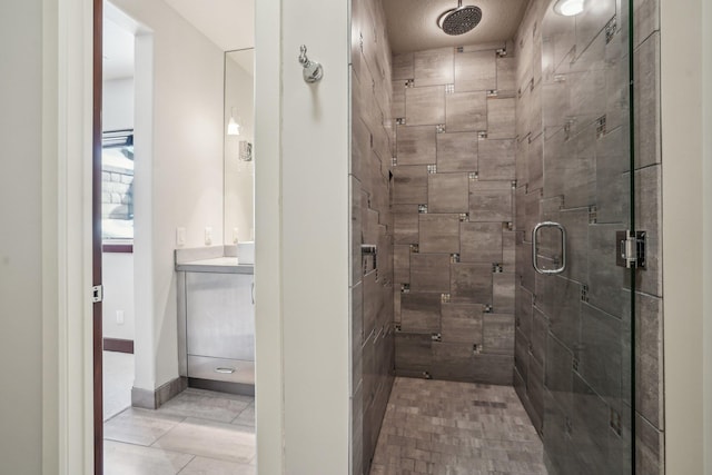9730 Sky Ln, Eden Prairie, MN 55347 - bathroom with a stall shower, vanity, tile patterned floors, and baseboards