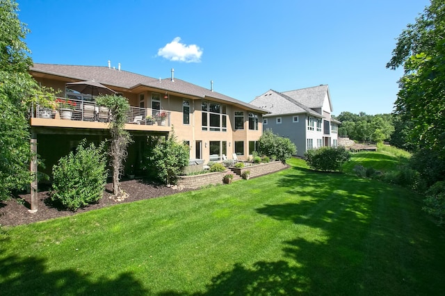 9730 Sky Ln, Eden Prairie, MN 55347 - back of property featuring a lawn, stucco siding, and a wooden deck