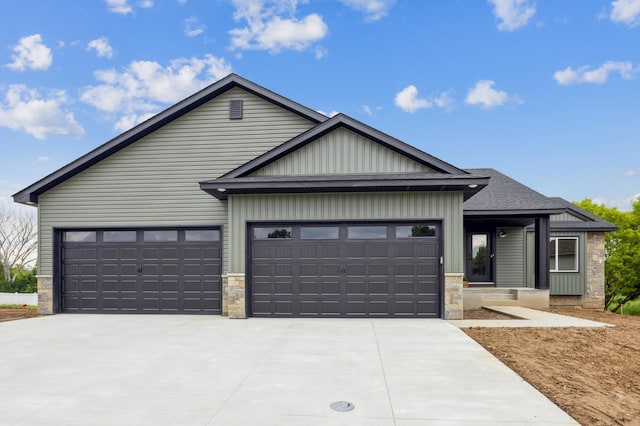 4695 3rd Street Loop NE, Saint Cloud, MN 56304 - view of front of home with stone siding, concrete driveway, a garage, and board and batten siding