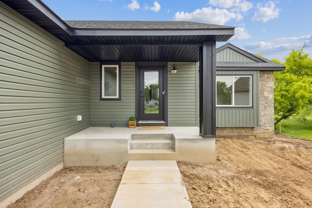4695 3rd Street Loop NE, Saint Cloud, MN 56304 - property entrance with board and batten siding and roof with shingles