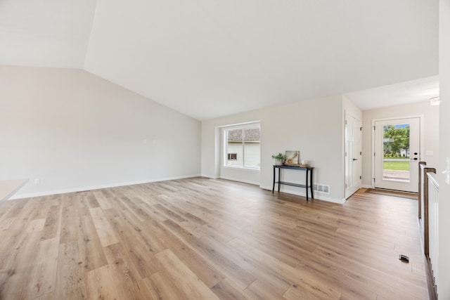 4695 3rd Street Loop NE, Saint Cloud, MN 56304 - unfurnished living room featuring light wood finished floors, vaulted ceiling, and baseboards