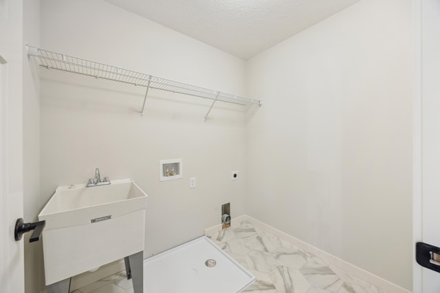 4695 3rd Street Loop NE, Saint Cloud, MN 56304 - washroom featuring marble look tile flooring, washer hookup, electric dryer hookup, baseboards, and a textured ceiling