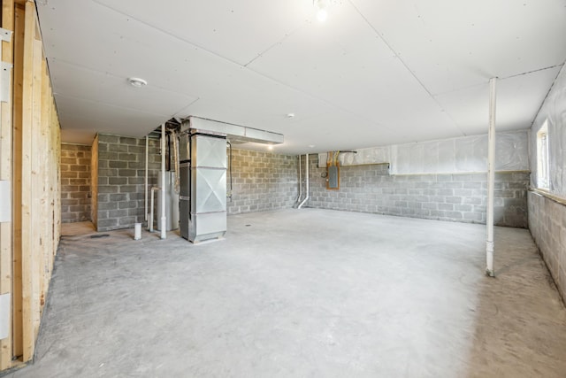 4695 3rd Street Loop NE, Saint Cloud, MN 56304 - below grade area with heating unit, concrete block wall, electric panel, and water heater