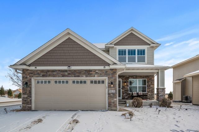 craftsman house with covered porch and central AC unit