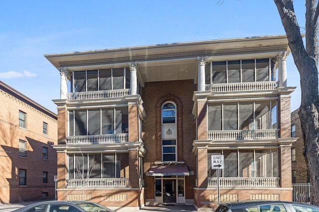 view of front of property featuring brick siding