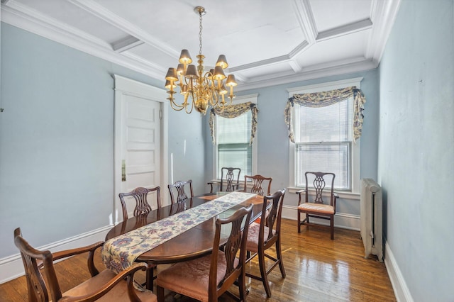 dining area featuring radiator, coffered ceiling, baseboards, and hardwood / wood-style flooring