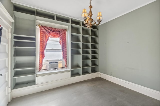 unfurnished dining area featuring carpet floors, crown molding, a chandelier, cooling unit, and baseboards