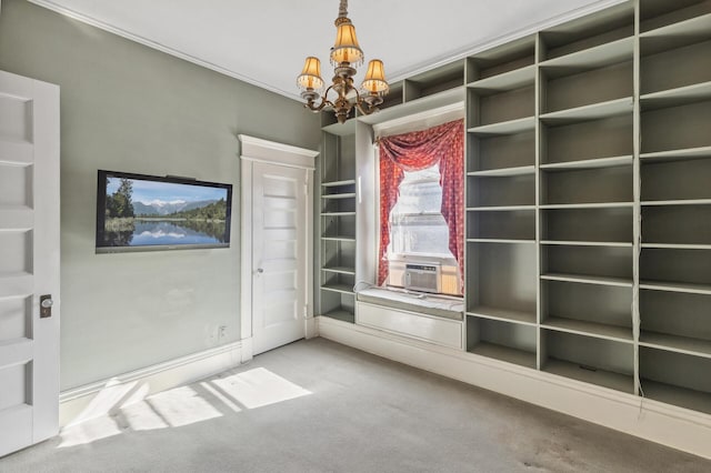 unfurnished dining area featuring carpet floors, cooling unit, and a chandelier