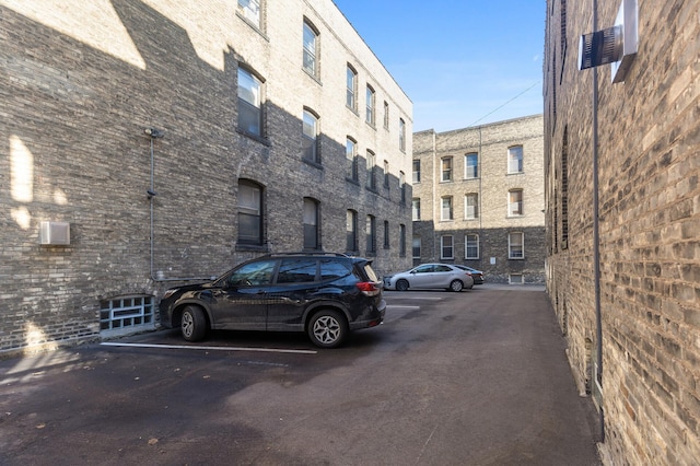 view of property featuring uncovered parking