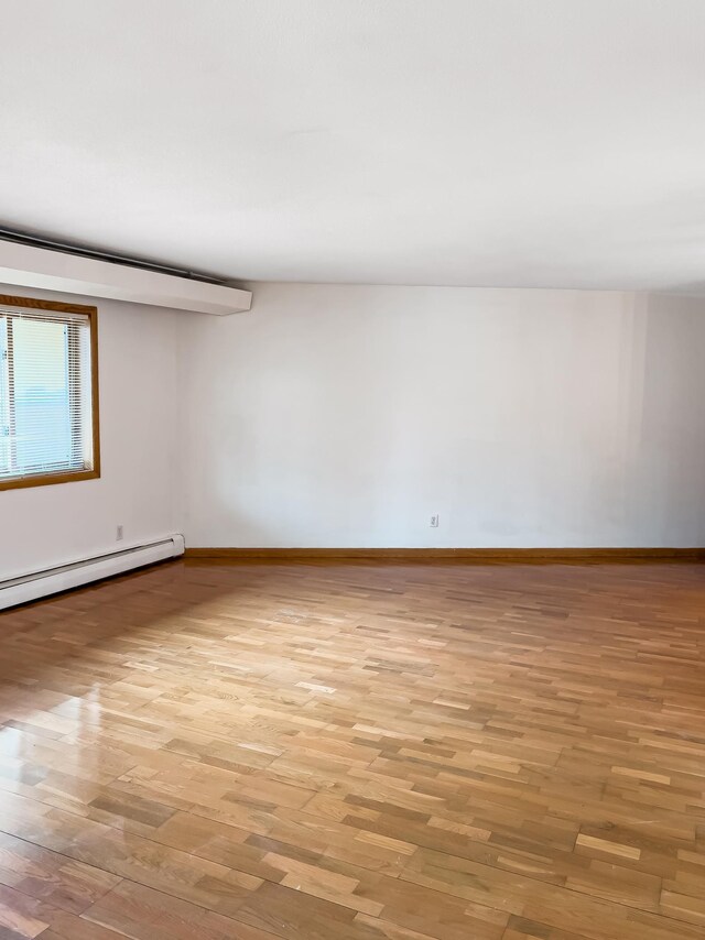 5440 Three Points Blvd Unit 513, Mound, MN 55364 - spare room featuring light wood-type flooring and baseboards