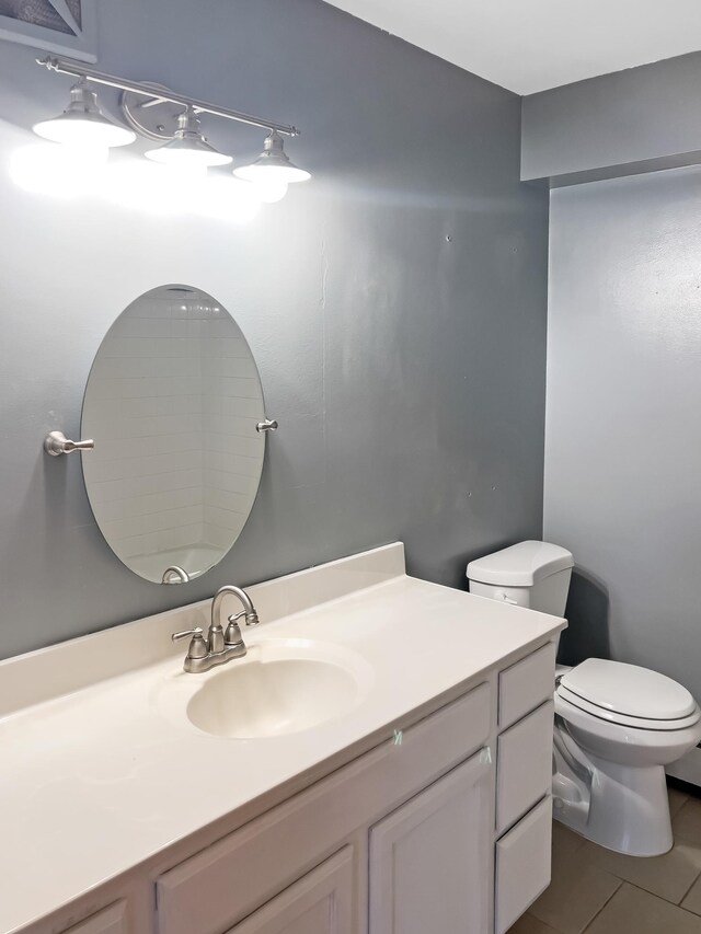 5440 Three Points Blvd Unit 513, Mound, MN 55364 - bathroom with vanity, toilet, and tile patterned floors