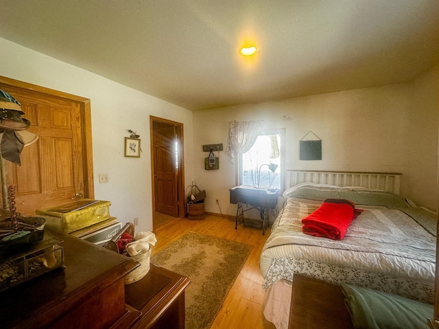 bedroom featuring light wood finished floors