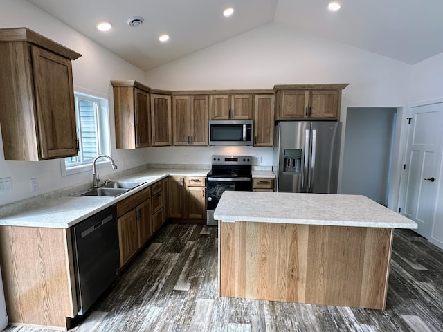 kitchen featuring a sink, visible vents, light countertops, appliances with stainless steel finishes, and a center island