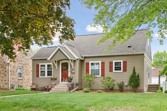 5824 10th Ave S, Minneapolis, MN 55417 - view of front of home with entry steps, a shingled roof, and a front yard