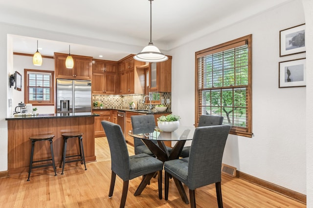 5824 10th Ave S, Minneapolis, MN 55417 - dining space with light wood-style floors and baseboards