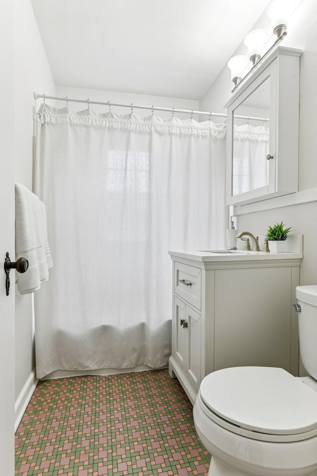 5824 10th Ave S, Minneapolis, MN 55417 - bathroom featuring tile patterned floors, toilet, and vanity